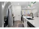 205 Walcrest Boulevard Se, Calgary, AB  - Indoor Photo Showing Kitchen With Double Sink With Upgraded Kitchen 