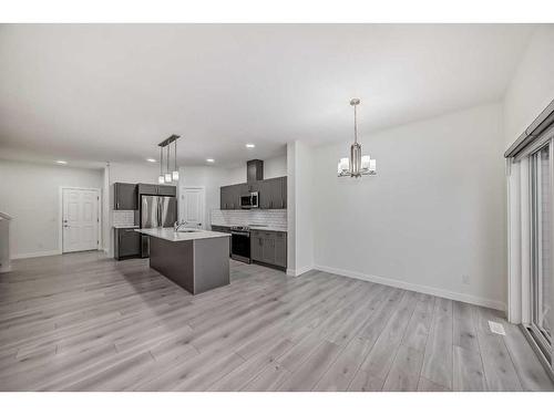 67 Belgian Crescent, Cochrane, AB - Indoor Photo Showing Kitchen