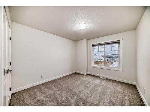 67 Belgian Crescent, Cochrane, AB - Indoor Photo Showing Other Room