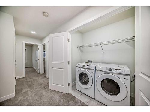 67 Belgian Crescent, Cochrane, AB - Indoor Photo Showing Laundry Room