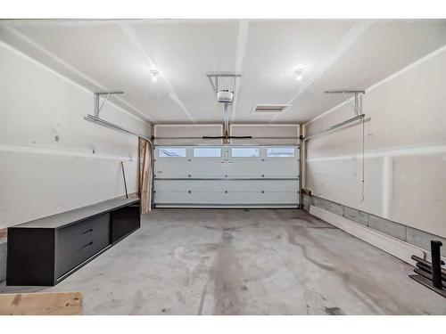 67 Belgian Crescent, Cochrane, AB - Indoor Photo Showing Garage