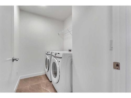 239 Kinniburgh Loop, Chestermere, AB - Indoor Photo Showing Laundry Room