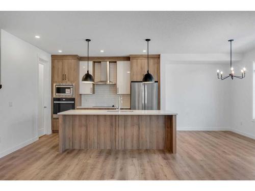 239 Kinniburgh Loop, Chestermere, AB - Indoor Photo Showing Kitchen With Stainless Steel Kitchen With Upgraded Kitchen