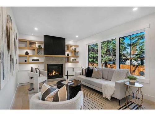 42 Canova Road Sw, Calgary, AB - Indoor Photo Showing Living Room With Fireplace