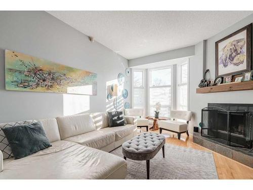 747 5A Street Nw, Calgary, AB - Indoor Photo Showing Living Room With Fireplace