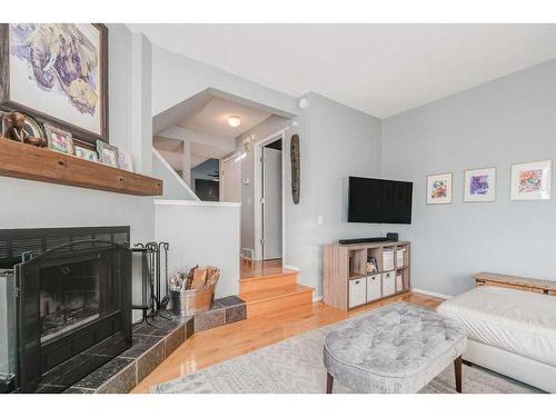 747 5A Street Nw, Calgary, AB - Indoor Photo Showing Living Room With Fireplace