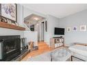 747 5A Street Nw, Calgary, AB  - Indoor Photo Showing Living Room With Fireplace 