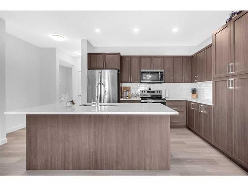 2038 Fowler Road Sw, Airdrie, AB - Indoor Photo Showing Kitchen With Upgraded Kitchen