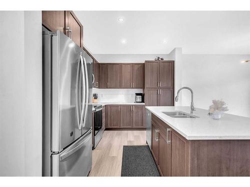 2038 Fowler Road Sw, Airdrie, AB - Indoor Photo Showing Kitchen With Double Sink With Upgraded Kitchen