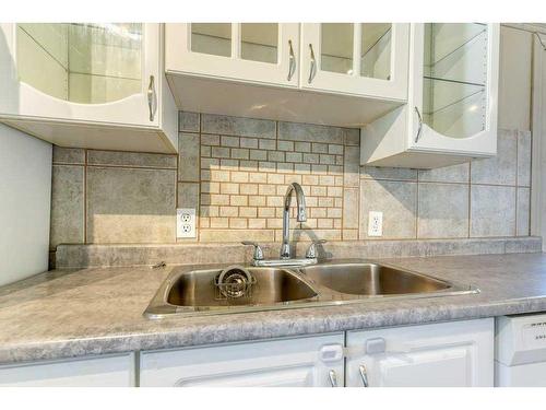 204 8 Avenue, Gleichen, AB - Indoor Photo Showing Kitchen With Double Sink