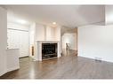 2-433 13 Avenue Ne, Calgary, AB  - Indoor Photo Showing Living Room With Fireplace 