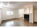 2-433 13 Avenue Ne, Calgary, AB  - Indoor Photo Showing Other Room With Fireplace 