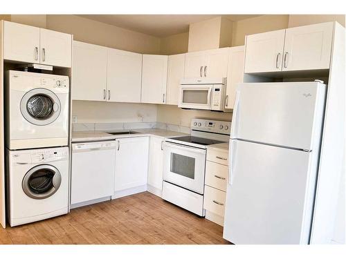 306-10 Brentwood Common Nw, Calgary, AB - Indoor Photo Showing Laundry Room