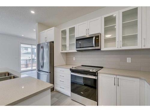 2070 Fowler Road Sw, Airdrie, AB - Indoor Photo Showing Kitchen With Upgraded Kitchen