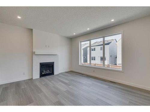 2070 Fowler Road Sw, Airdrie, AB - Indoor Photo Showing Living Room With Fireplace