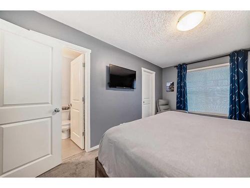 18 Legacy Boulevard Se, Calgary, AB - Indoor Photo Showing Bedroom