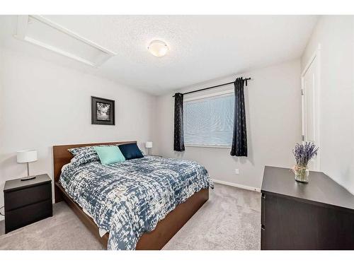 18 Legacy Boulevard Se, Calgary, AB - Indoor Photo Showing Bedroom