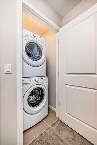 18 Legacy Boulevard Se, Calgary, AB - Indoor Photo Showing Laundry Room