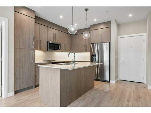 213-383 Smith Street Nw, Calgary, AB - Indoor Photo Showing Kitchen With Stainless Steel Kitchen With Upgraded Kitchen