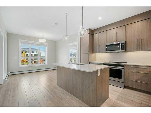 213-383 Smith Street Nw, Calgary, AB - Indoor Photo Showing Kitchen With Upgraded Kitchen