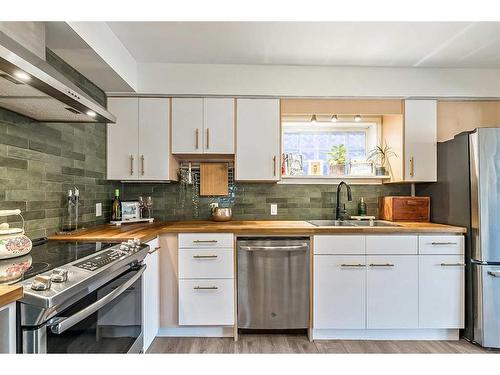 2023 8 Avenue Se, Calgary, AB - Indoor Photo Showing Kitchen With Stainless Steel Kitchen With Double Sink