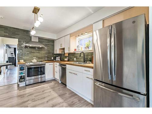 2023 8 Avenue Se, Calgary, AB - Indoor Photo Showing Kitchen With Stainless Steel Kitchen With Double Sink