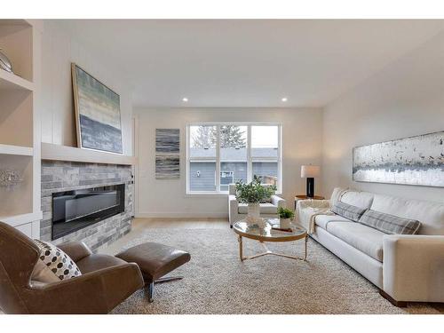 4909 19 Avenue Nw, Calgary, AB - Indoor Photo Showing Living Room With Fireplace