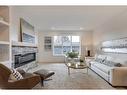 4909 19 Avenue Nw, Calgary, AB  - Indoor Photo Showing Living Room With Fireplace 