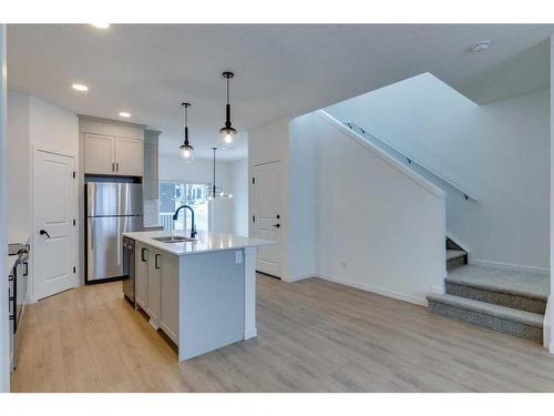 545 Bayview Street Sw, Airdrie, AB - Indoor Photo Showing Kitchen With Stainless Steel Kitchen With Upgraded Kitchen