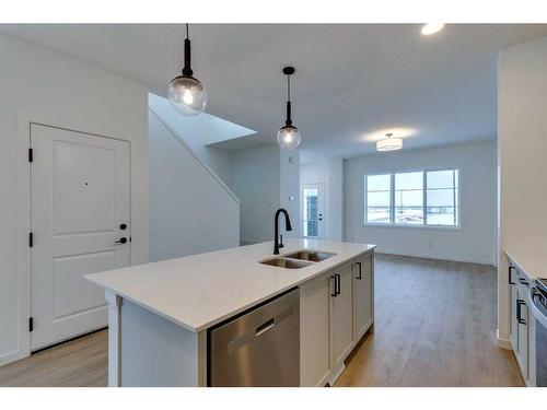 545 Bayview Street Sw, Airdrie, AB - Indoor Photo Showing Kitchen With Double Sink