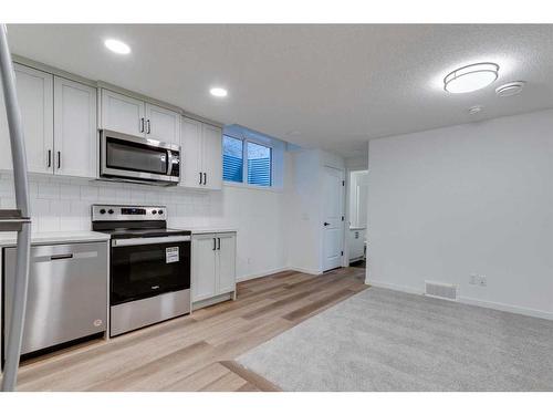 545 Bayview Street Sw, Airdrie, AB - Indoor Photo Showing Kitchen With Stainless Steel Kitchen