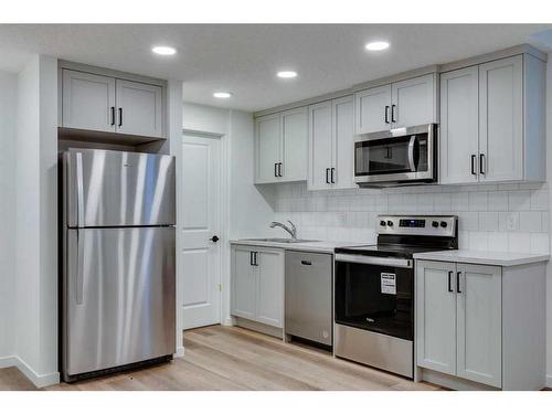 545 Bayview Street Sw, Airdrie, AB - Indoor Photo Showing Kitchen With Stainless Steel Kitchen