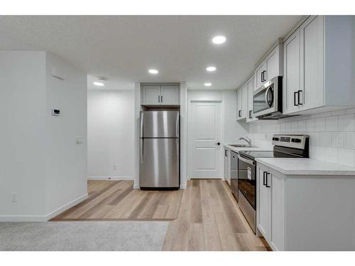 545 Bayview Street Sw, Airdrie, AB - Indoor Photo Showing Kitchen With Stainless Steel Kitchen