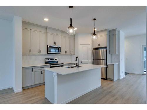 545 Bayview Street Sw, Airdrie, AB - Indoor Photo Showing Kitchen With Stainless Steel Kitchen With Upgraded Kitchen