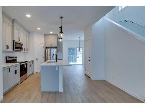 545 Bayview Street Sw, Airdrie, AB - Indoor Photo Showing Kitchen With Stainless Steel Kitchen With Upgraded Kitchen