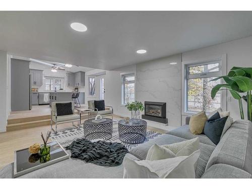 35 Mckinley Road Se, Calgary, AB - Indoor Photo Showing Living Room With Fireplace