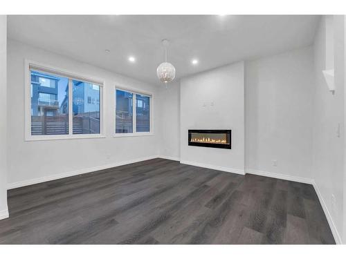 114 Lucas Terrace Nw, Calgary, AB - Indoor With Fireplace