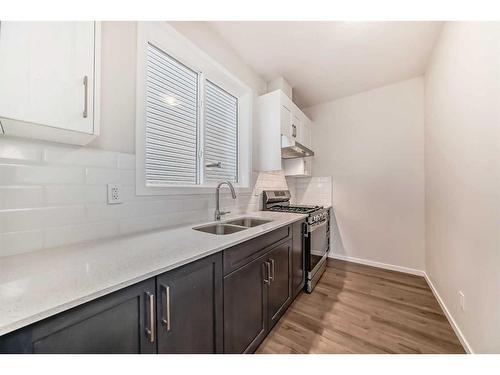 44 Cityline Heath Ne, Calgary, AB - Indoor Photo Showing Kitchen With Double Sink