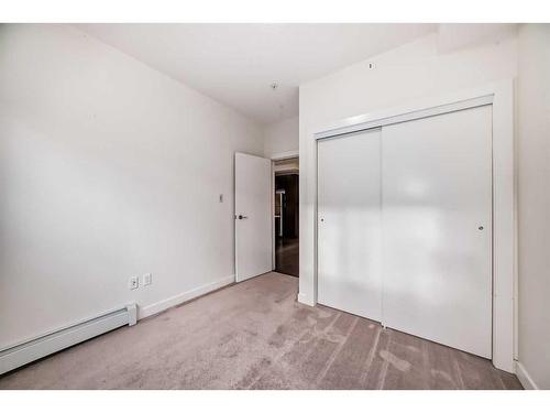 112-15233 1 Street Se, Calgary, AB - Indoor Photo Showing Other Room