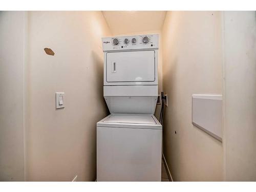 112-15233 1 Street Se, Calgary, AB - Indoor Photo Showing Laundry Room