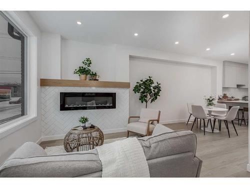 3927 65 Street Nw, Calgary, AB - Indoor Photo Showing Living Room With Fireplace