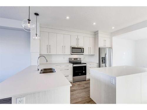 387 Chelsea Parade, Chestermere, AB - Indoor Photo Showing Kitchen With Stainless Steel Kitchen With Double Sink With Upgraded Kitchen