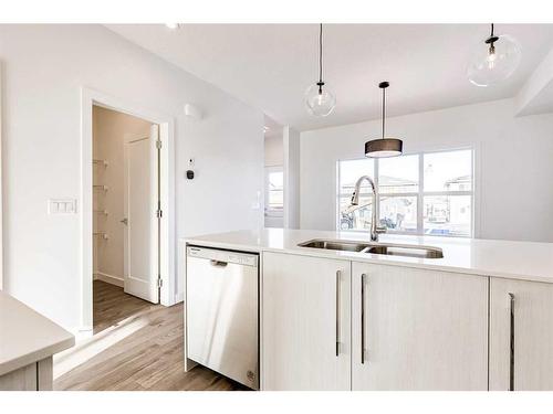 387 Chelsea Parade, Chestermere, AB - Indoor Photo Showing Kitchen With Double Sink With Upgraded Kitchen