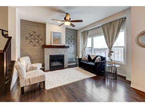 124 Walden Parade Se, Calgary, AB - Indoor Photo Showing Living Room With Fireplace