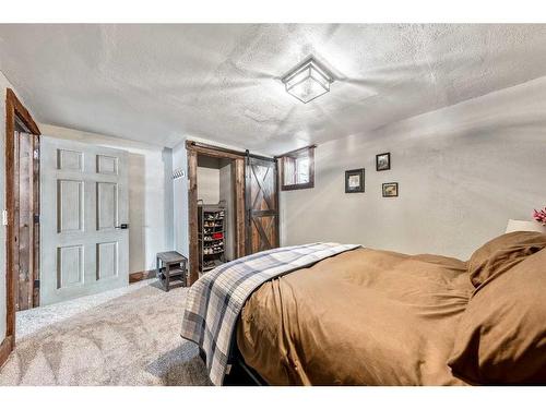 10 Ghost Country Place, Waiparous, AB - Indoor Photo Showing Bedroom