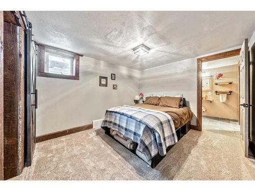 10 Ghost Country Place, Waiparous, AB - Indoor Photo Showing Bedroom