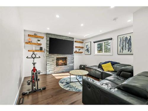 210 Canterbury Place Sw, Calgary, AB - Indoor Photo Showing Living Room With Fireplace