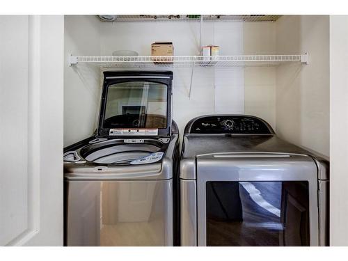 24 Signature Villas Sw, Calgary, AB - Indoor Photo Showing Laundry Room