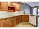 24 Signature Villas Sw, Calgary, AB  - Indoor Photo Showing Kitchen With Double Sink 