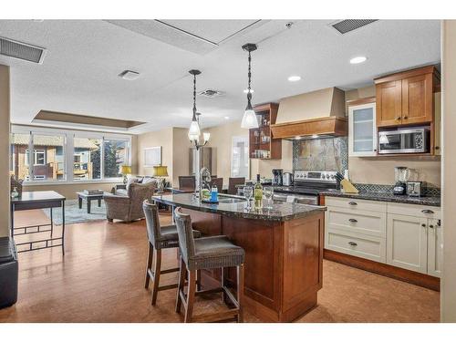 301-173 Kananaskis Way, Canmore, AB - Indoor Photo Showing Kitchen With Upgraded Kitchen